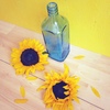 zonnebloemen en glaswerk